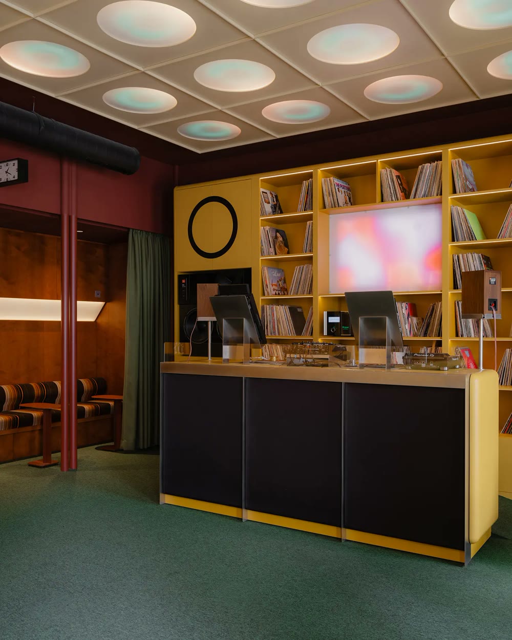 DJ booth with illuminated modernist ceiling
